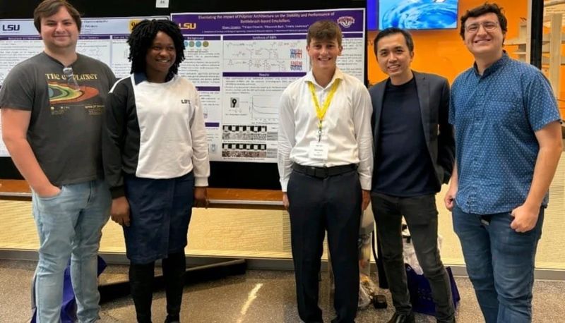 Group members at a conference poster